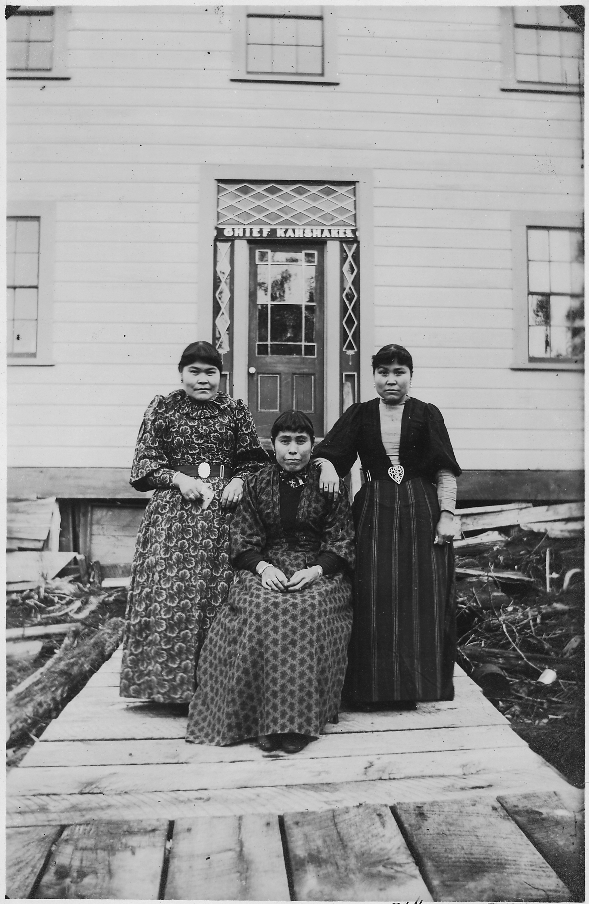 Portrait
Three young Indian women (unidentified) in front of residence of Chief Kahshakes.